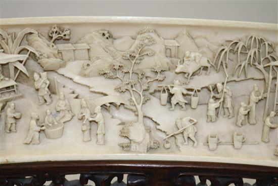 A fine Chinese ivory fan-shaped panel, late 19th/early 20th century,